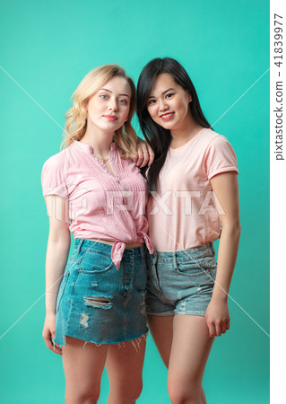 attractive funny joyful multiracial girls clothed in summer casual outfit 41839977
