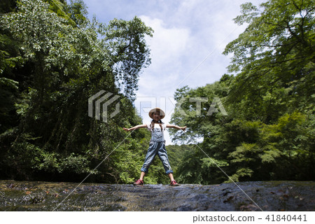 Girls playing on mountain streams 41840441