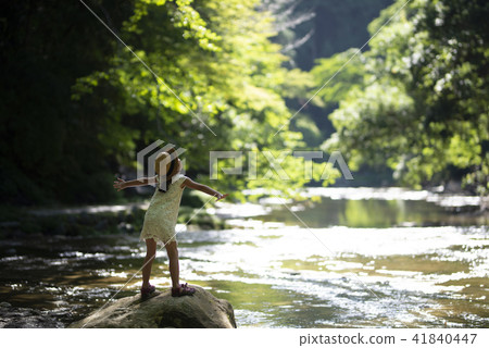 Girls playing on mountain streams 41840447