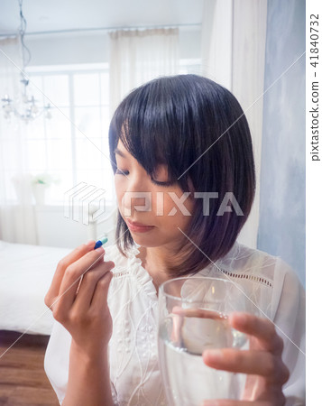 Girl taking medicine 41840732