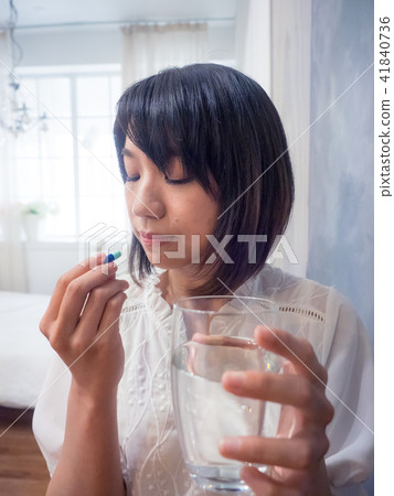 Girl taking medicine Girl taking medicine 41840736