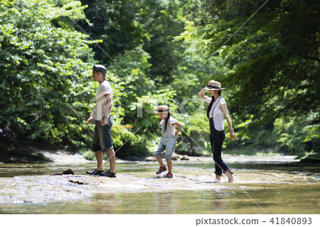 Families playing in the river 41840893