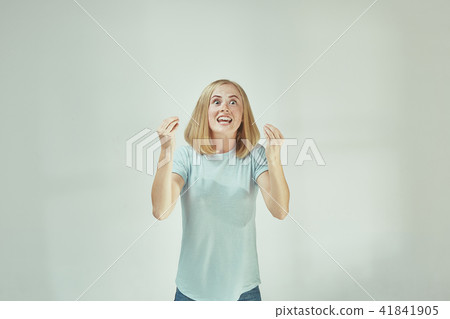 Beautiful female half-length portrait isolated on gray studio backgroud. The young emotional Beautiful female half-length portrait isolated on gray studio backgroud. The young emotional 41841905