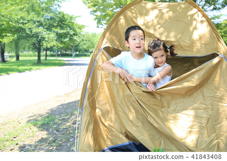Children playing with tents 41843408