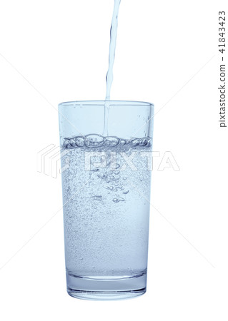 pouring mineral water in transparent glass, drops pouring mineral water in transparent glass, drops 41843423