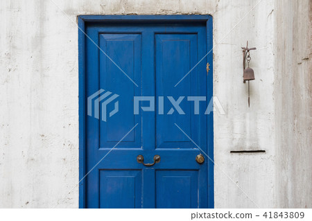Antique blue door and old bell on wall Antique blue door and old bell on wall 41843809
