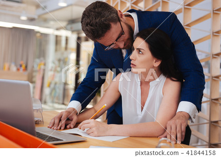 Ardent man seducing his a woman at work 41844158