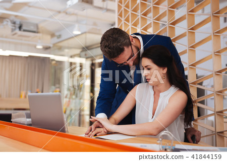 Excited man touching his colleagues hand 41844159