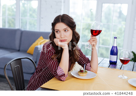 Appealing woman with nice hairstyle drinking wine 41844248