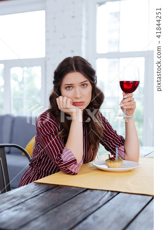 Charming woman feeling lonely waiting for her man in restaurant Charming woman feeling lonely waiting for her man in restaurant 41844251