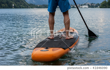 stand up paddle boarding on the lake 41846090