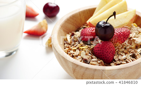 Oatmeal flakes, milk, fresh fruits on background. 41846810