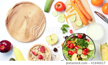 empty wooden plate, mixed vegetables salad, muesli 41846817