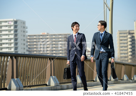 Businessman Commuting commuting walking blue sky business image Businessman Commuting commuting walking blue sky business image 41847455