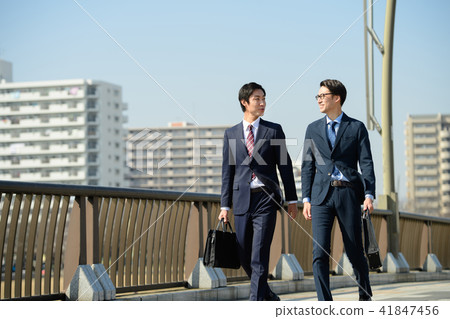 Businessman Commuting commuting walking blue sky business image Businessman Commuting commuting walking blue sky business image 41847456