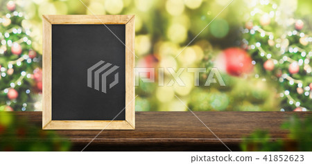 blackboard on dark brown wood table with christmas blackboard on dark brown wood table with christmas 41852623
