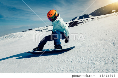 one snowboarder snowboarding in winter mountains one snowboarder snowboarding in winter mountains 41853151