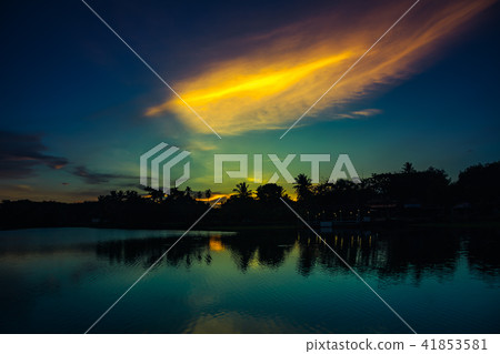 Sky sunset with cloud above silhouettes of trees 41853581