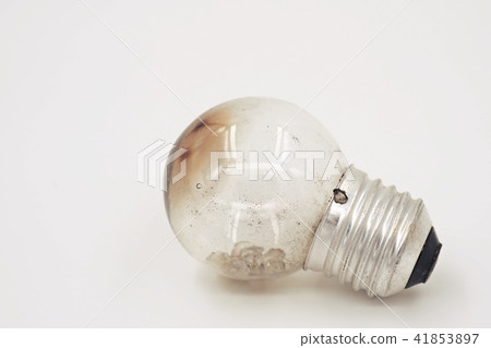 Burned light bulb on white background Burned light bulb on white background 41853897