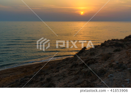 Sunset over the sea on wild beach of Persian gulf 41853906