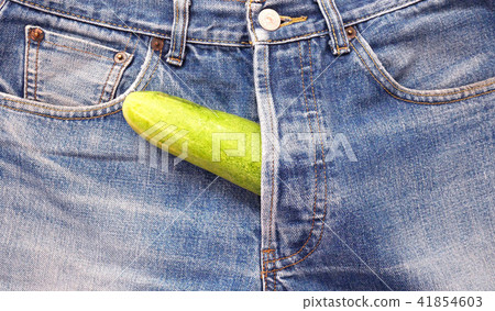 Cucumber out of jeans like mens penis. Cucumber out of jeans like mens penis. 41854603