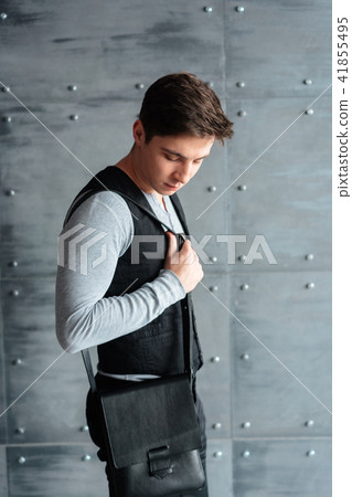 handsome guy with leather bag handsome guy with leather bag 41855495