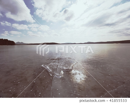 Beautiful transparent ice piece, Lake against sky 41855533