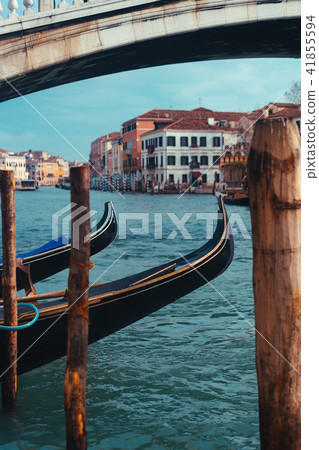 Venetian channel with ancient houses and boats Venetian channel with ancient houses and boats 41855594