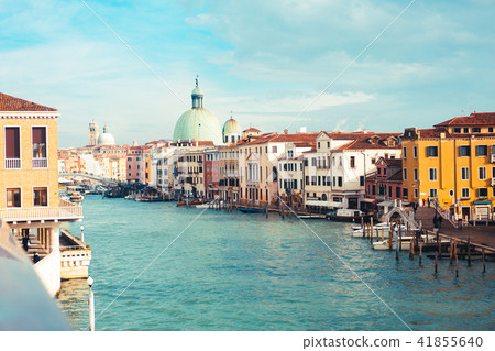 Venetian channel with ancient houses and boats Venetian channel with ancient houses and boats 41855640