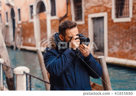 Tourist taking photos in Venice Tourist taking photos in Venice 41855680