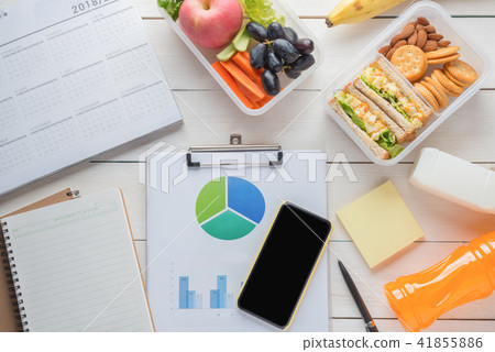 Office desk with supplies, Egg salad with sandwich Office desk with supplies, Egg salad with sandwich 41855886