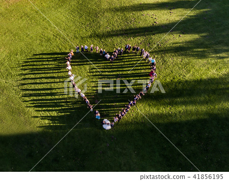 Wedding guests lined up in the shape of heart with bride and groom marriage people Wedding guests lined up in the shape of heart with bride and groom marriage people 41856195