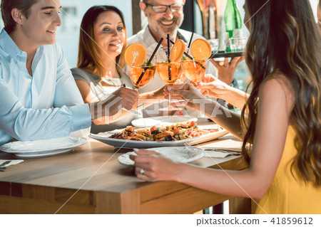 Beautiful woman toasting with her boyfriend and her best friends 41859612