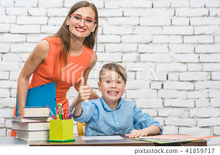 Pupil and teacher having fun at school 41859717