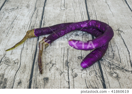 rotten purple eggplant put on wooden table rotten purple eggplant put on wooden table 41860619