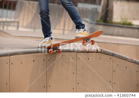 Skateboarder sakteboarding on skatepark ramp 41860744