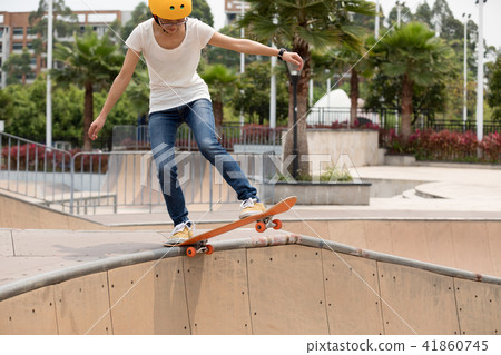 Skateboarder on skatepark ramp Skateboarder on skatepark ramp 41860745