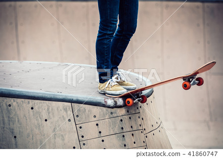 Skateboarder sakteboarding on skatepark ramp Skateboarder sakteboarding on skatepark ramp 41860747