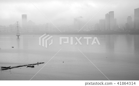 Riverside landscape with clouds and boat 41864314