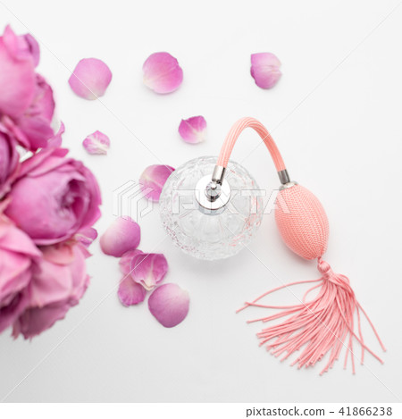 Perfume bottle with flowers on white background. Perfumery, cosmetics, fragrance collection. 41866238
