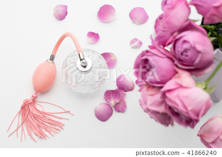 Perfume bottle with flowers on white background. Perfumery, cosmetics, fragrance collection. 41866240