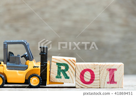 Toy forklift hold letter block  in word ROI 41869451