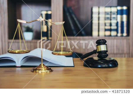 Scales of justice and Gavel on sounding block and law book to wo Scales of justice and Gavel on sounding block and law book to wo 41871320