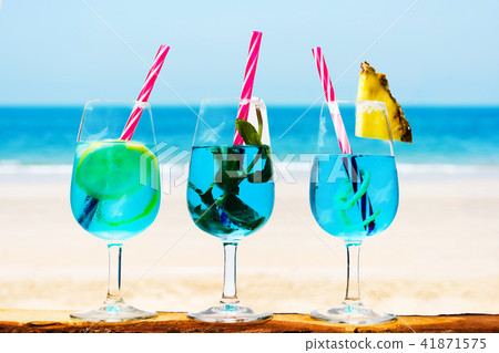 Blue cocktails against seaside background 41871575