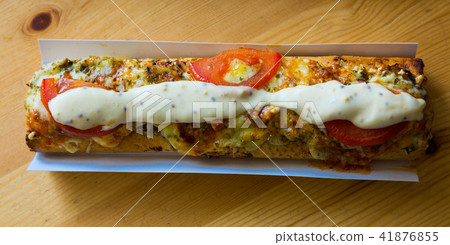 Polish zapiekanka toasted baguette with cheese and vegetables 41876855