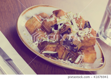 Plate with steamed eggplants with honey and cheese Plate with steamed eggplants with honey and cheese 41876941