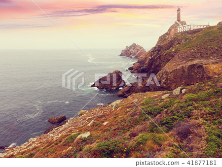 lighthouse on the rocky coast 41877181