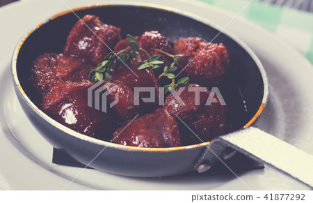 Photo of fried meat in sauce on pan 41877292