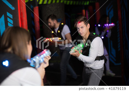 Excited guy during lasertag game Excited guy during lasertag game 41879119