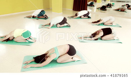 People relaxing and enjoying yoga elements People relaxing and enjoying yoga elements 41879165